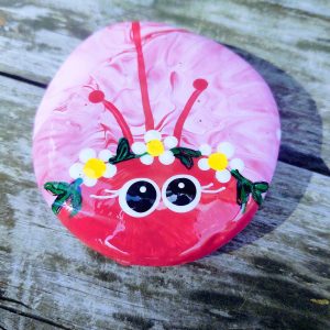 pink painted lady bug rock